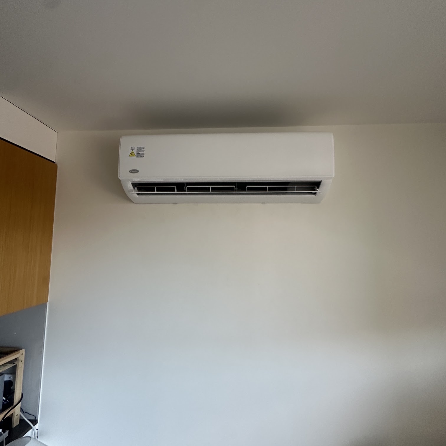 Clean wall mounted split system air conditioner in a rental property